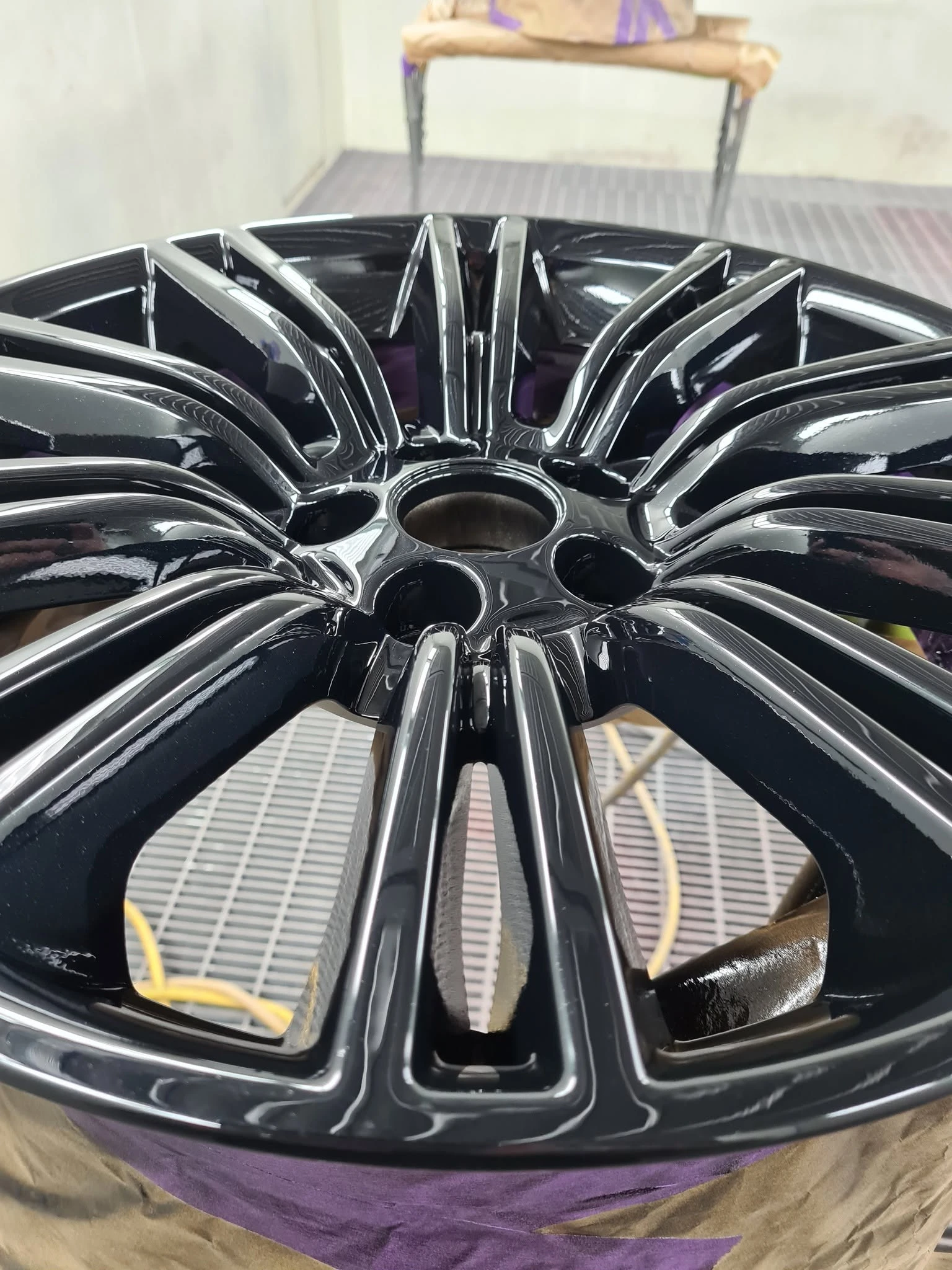 Freshly painted black alloy rims — spray painting Cairns