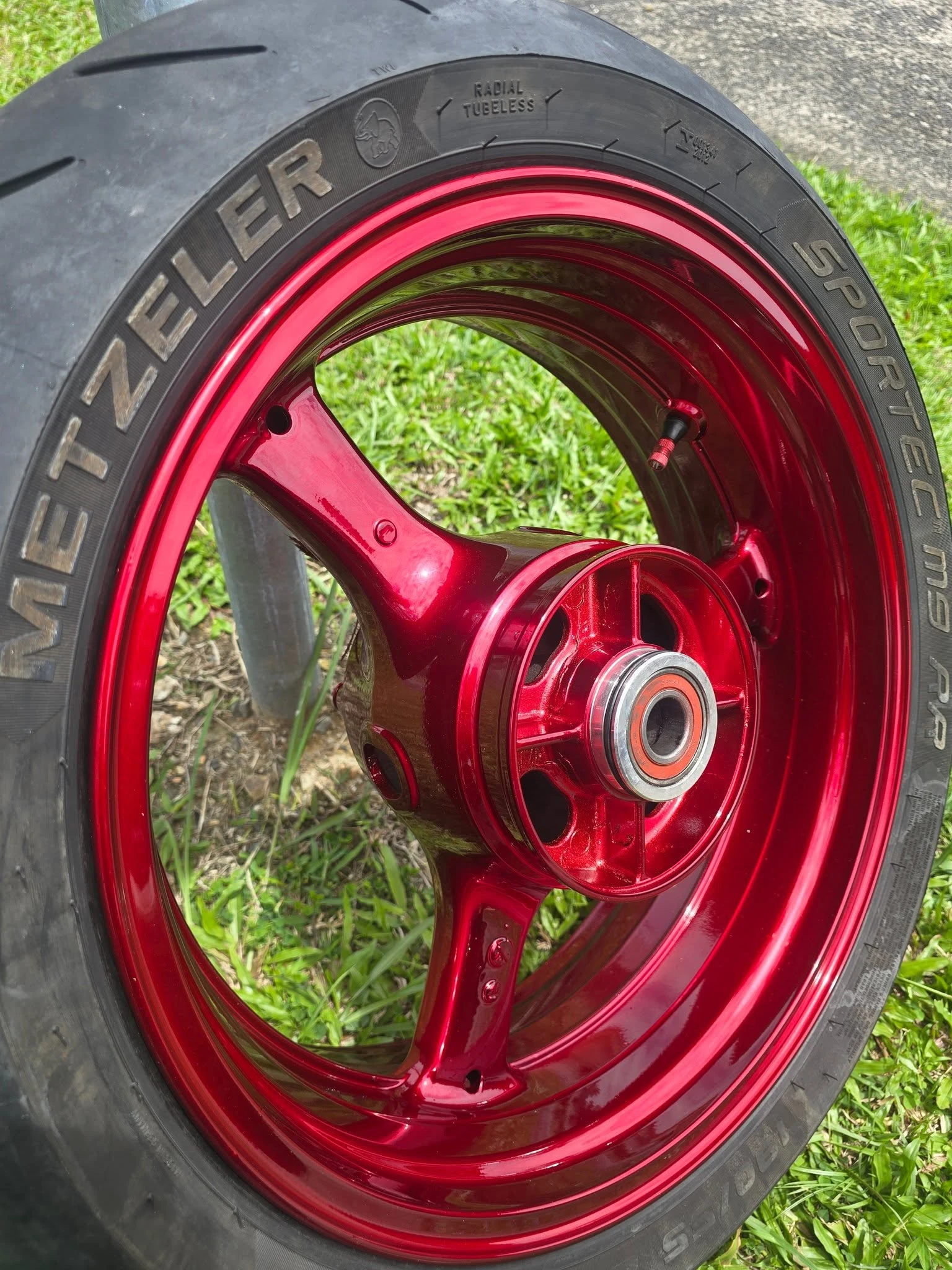 Freshly painted motorcycle rim — motorcycle smash repair Cairns