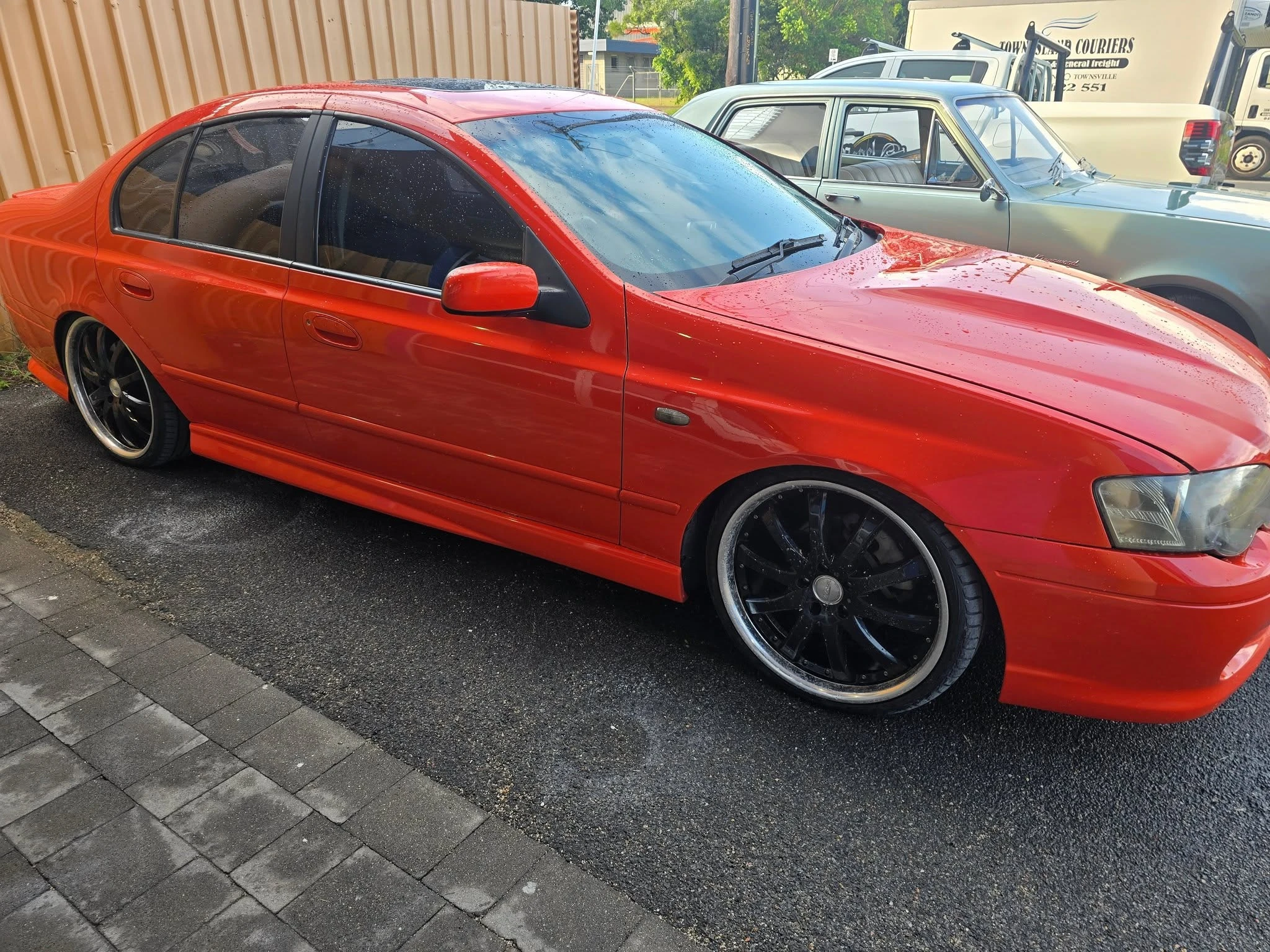 Full vehicle respray result — orange BA Falcon by Pigment to Panel Cairns