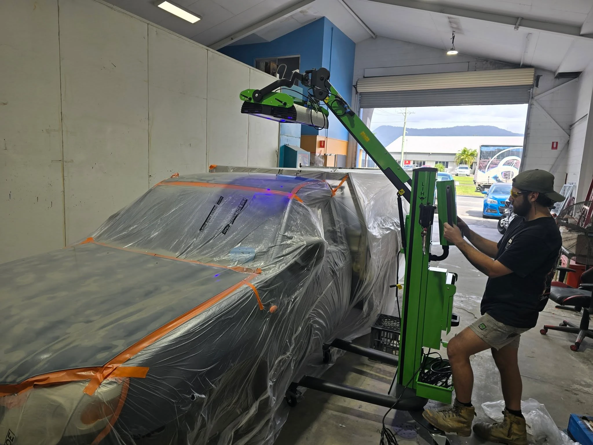 Owner operating panel pulling equipment at Pigment to Panel Refinishing
