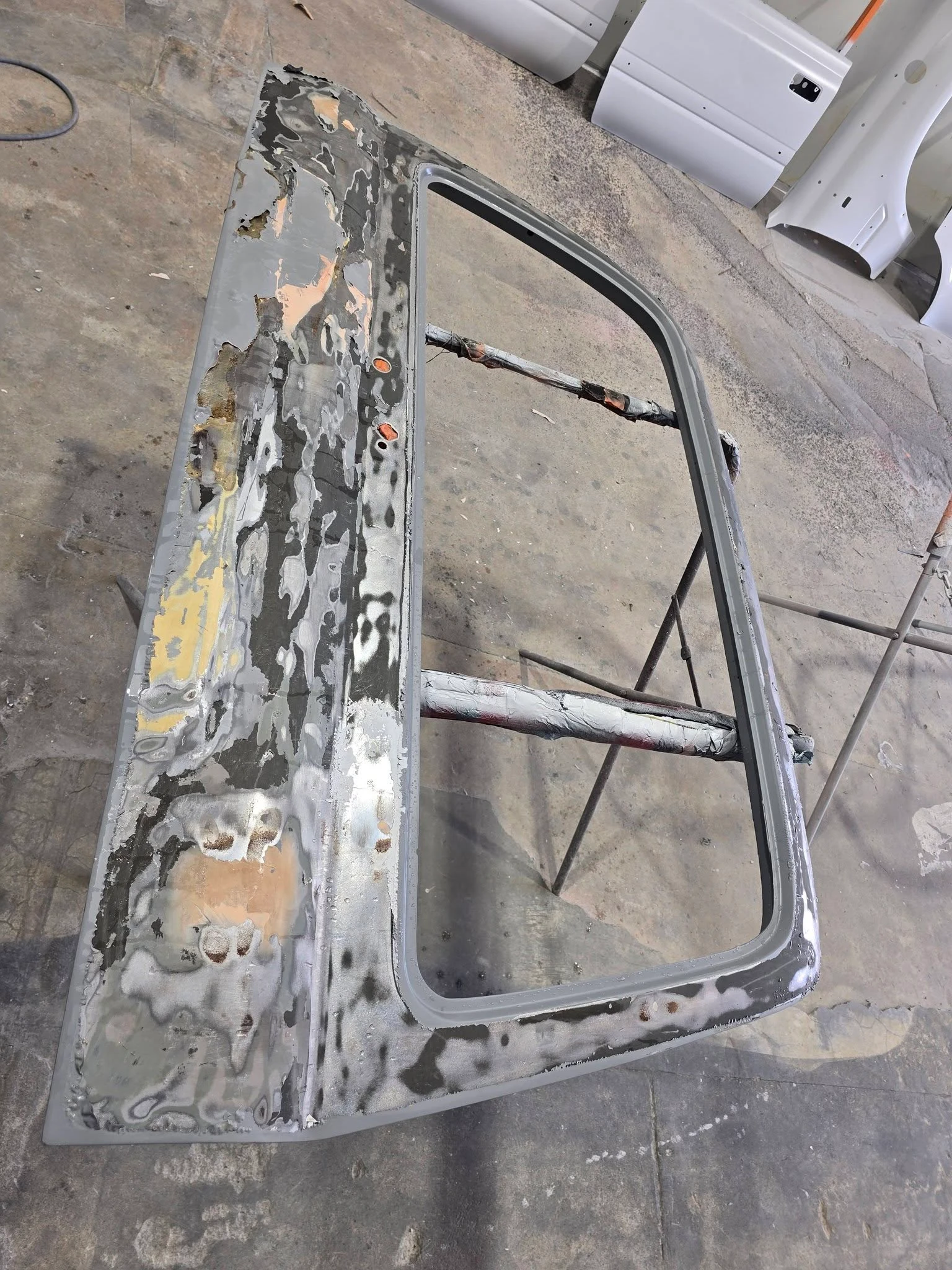 Panel being stripped and prepped for repair — panel beater Cairns
