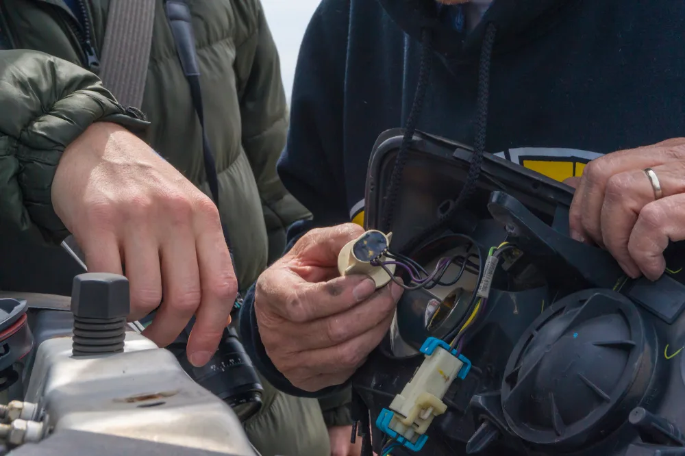 Headlight lens being assessed for UV damage restoration Cairns